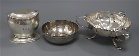 An Art Nouveau style silver three-handled bowl, Birmingham 1915, Elkington & Co, a silver tea caddy and a 925 standard bowl
